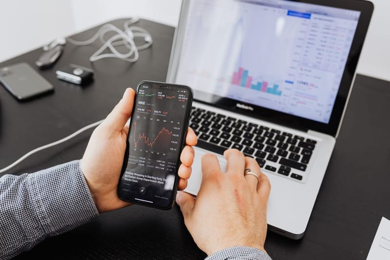 Market prices displayed on a phone and monitor