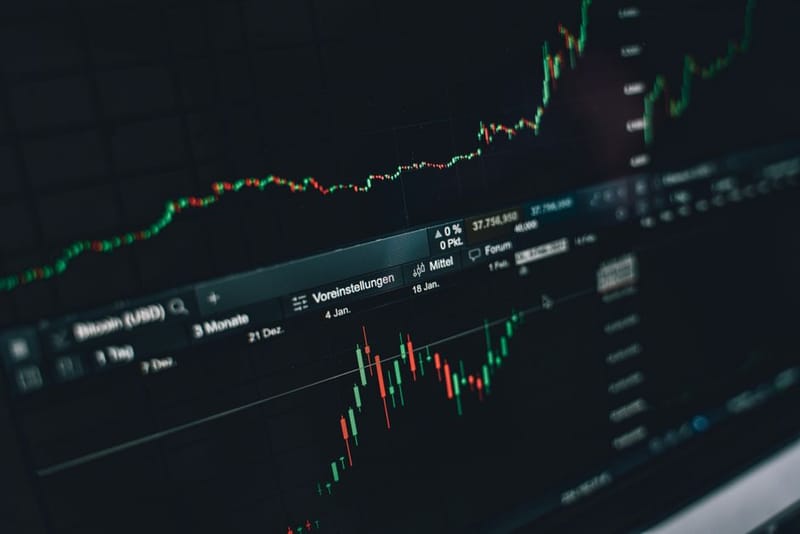 Noisy market data chart on a screen